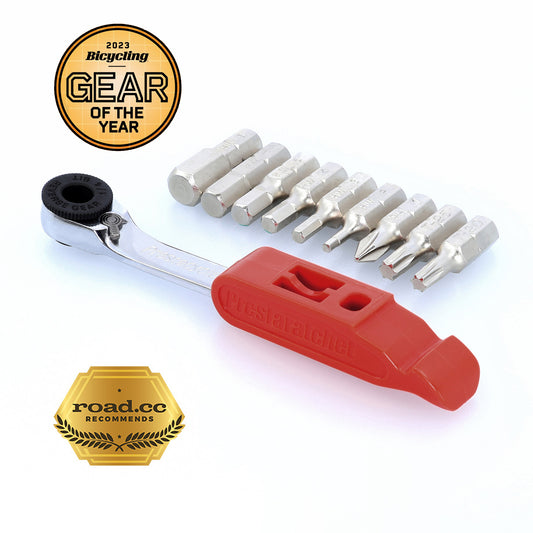 The Prestaratchet GO is a compact 5-in-1 ratcheting multi-tool kit with a red handle, nine metal screwdriver bits, and two awards: 2023 Bicycling Gear of the Year and road.cc recommends.