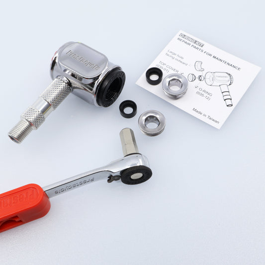 The Prestaflator Pro Presta Head Rebuild Kit, including a chrome ratchet tool with red handle, metal valve, washers, screws, Presta valve seal kit, and repair instruction sheet is displayed on a white background.