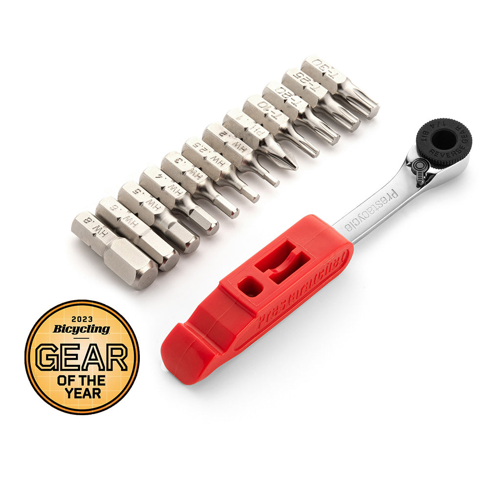 The Prestaratchet GO Wallet - 6 Function Multi-tool, a compact bicycle tool with a red handle and six interchangeable bits plus a reversible ratchet, is shown beside a 2023 Bicycling Gear of the Year award badge.