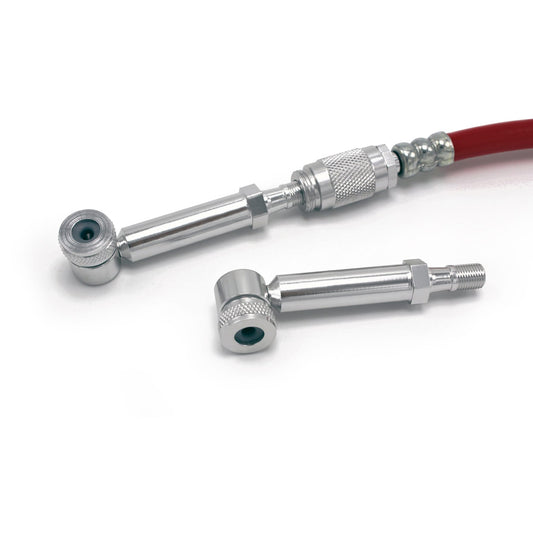 Two Prestacycle Disc Wheel Mini Presta Heads, silver metal adapters with threaded ends, are shown—one attached to a red hose with a metal connector, the other lying detached on a white background.