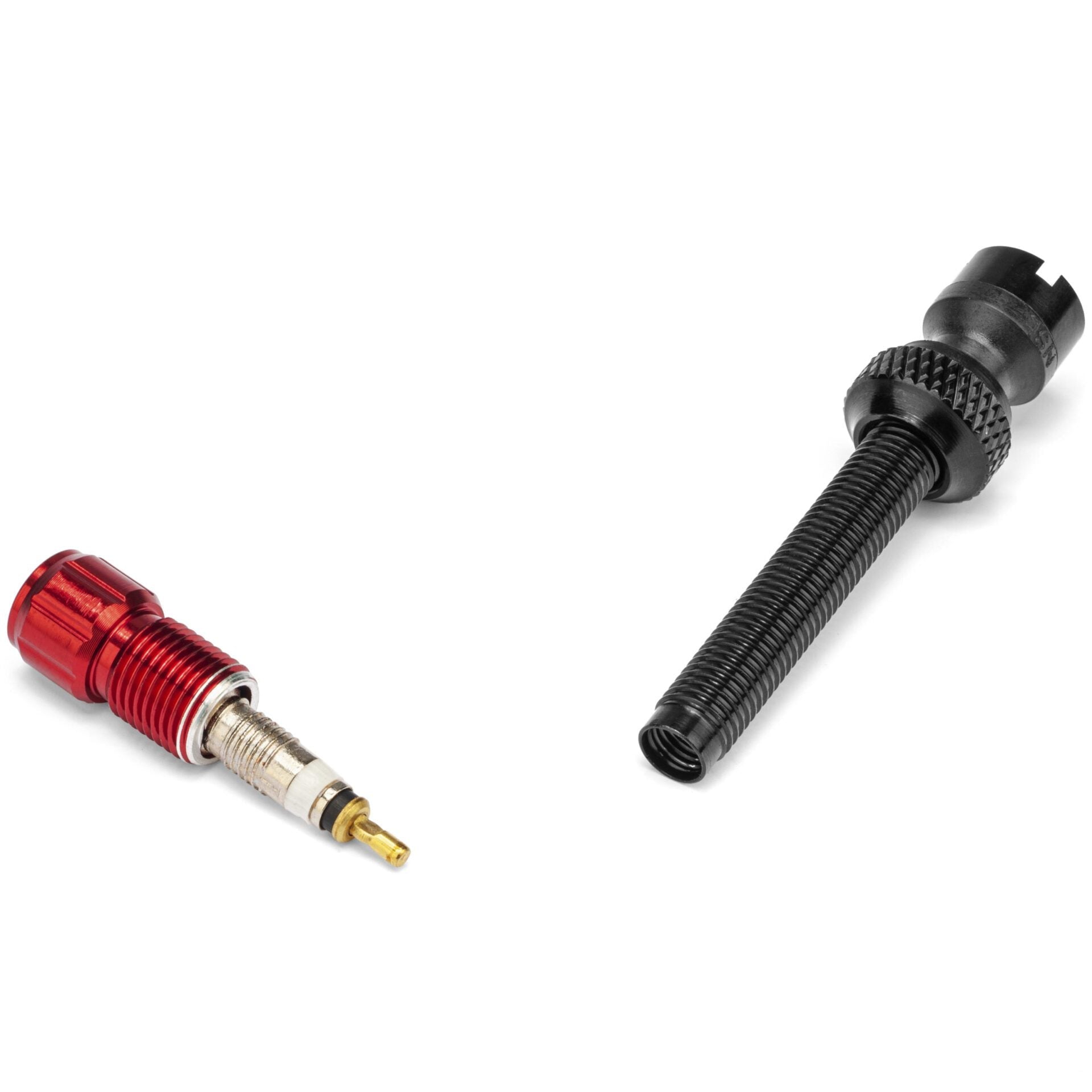 Two Prestacycle Prestadapters—Schrader to Presta adapter and valve core tools—one red/gold alloy with a threaded body, the other black with a textured grip and notched end, both shown on a white background.