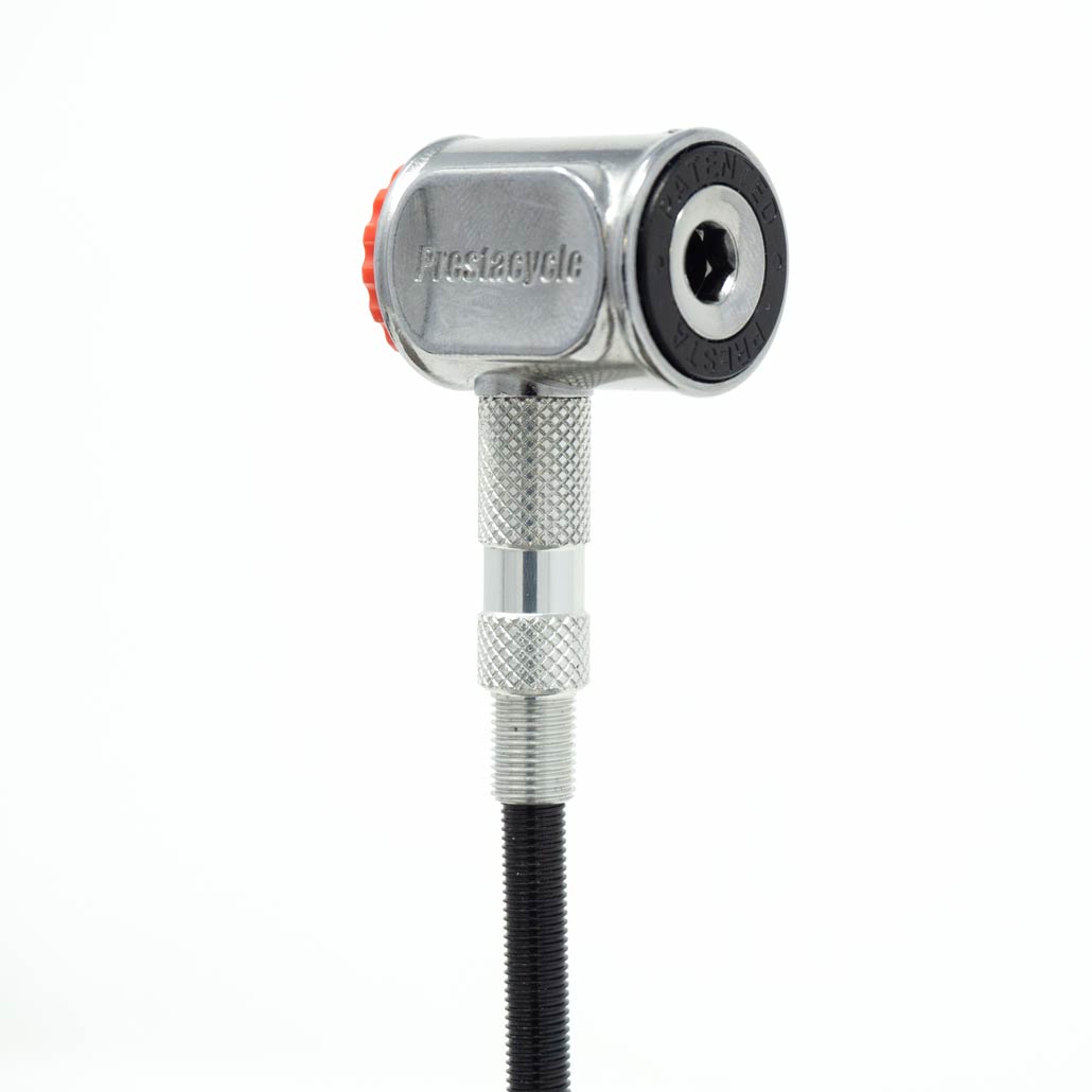 A close-up of the Prestacycle Pro Presta Head bicycle pump head, featuring an auto-lock Presta design, textured metal grip, red button, no-loss disconnect, and black nozzle, shown against a white background.