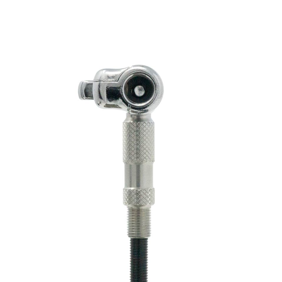 A close-up of the Prestacycle Pro Schrader Head, a shiny metal valve connector with a knurled grip and auto lock feature for precise tire pressure control, set against a plain white background.
