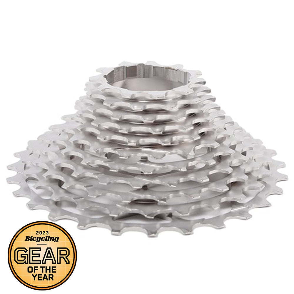 Stack of silver Prestacycle UniBlock PRO Cassette (11 Speed) (Shimano) gears, arranged in a cone shape, with a 2023 Bicycling Gear of the Year award badge in the lower left corner.