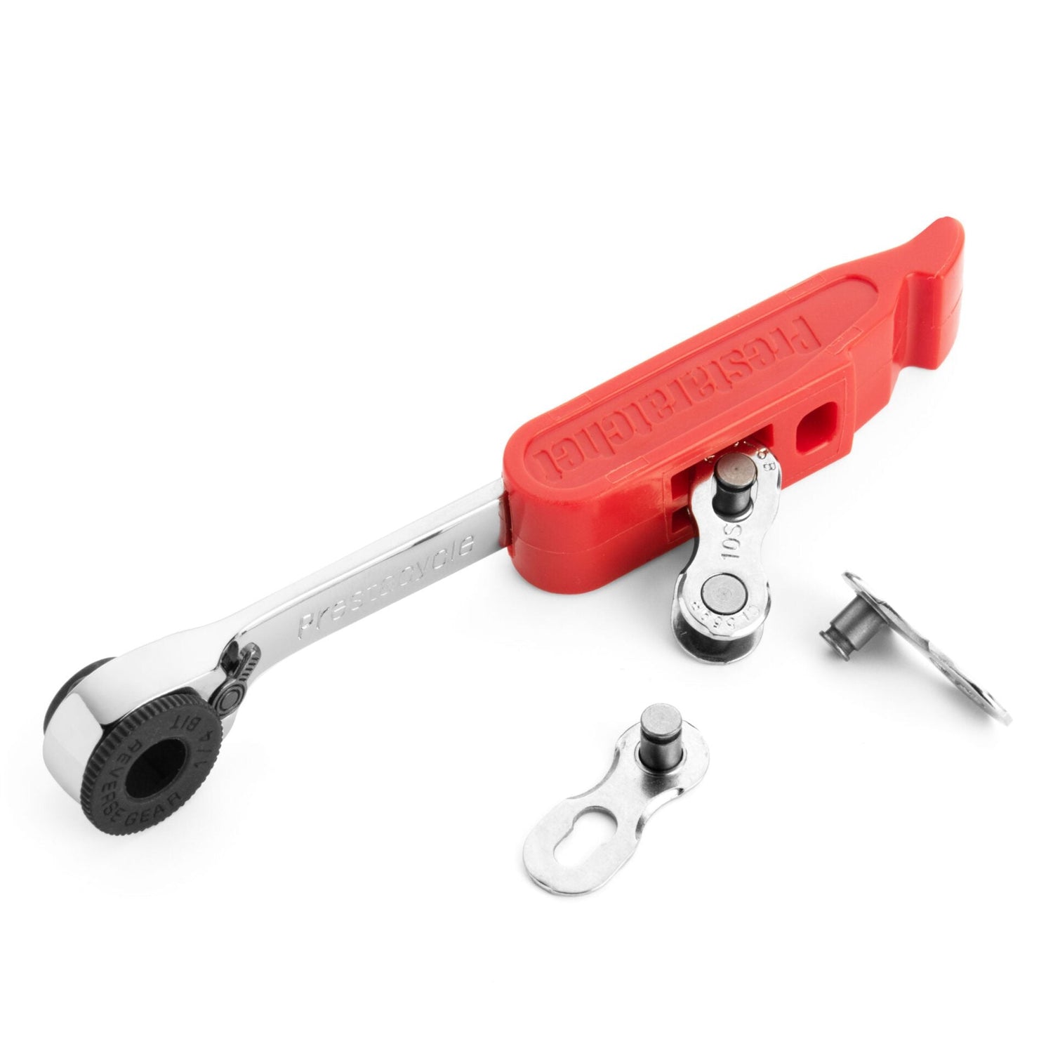 The Prestaratchet GO Wallet - 6 Function Multi-tool features a red handle and reversible ratchet arm, pictured with a bike chain link and chain pin.
