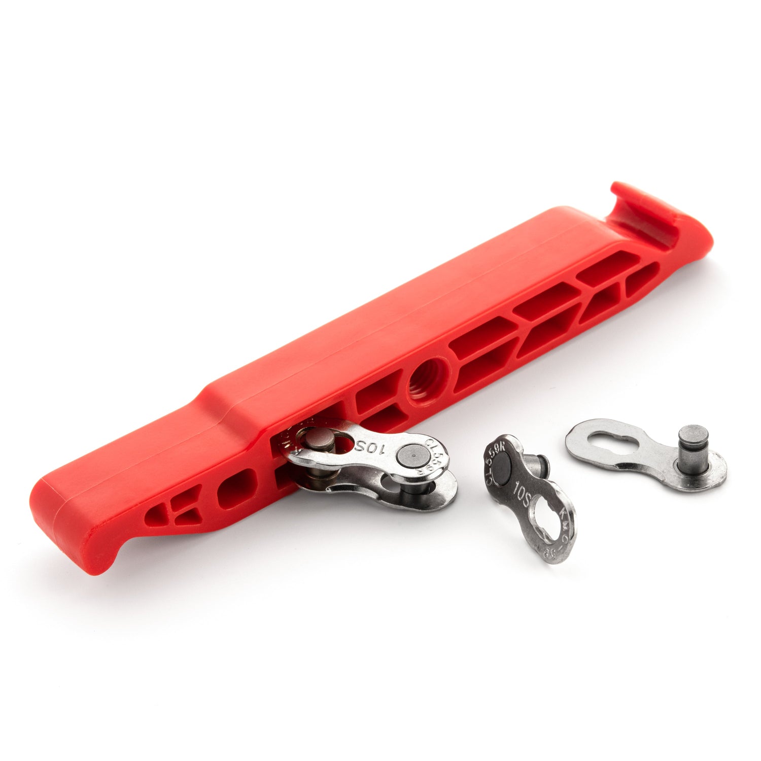 The Prestalever GO 4/5 Function Multi-tool Tire Lever in red plastic, shown with metal quick links and pins plus a Presta Valve Core tool, is displayed on a white background.