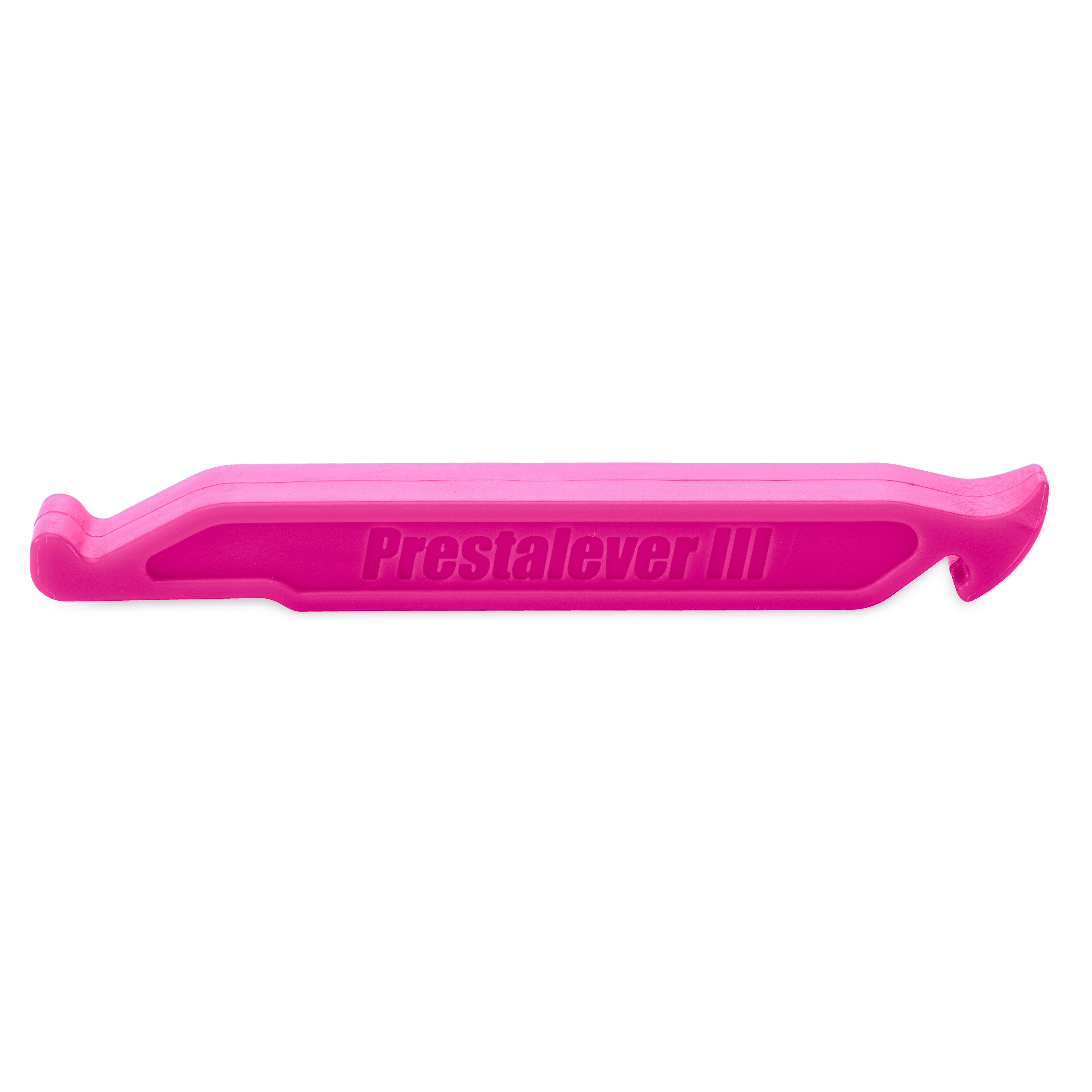 The Prestalever GO - 4/5 Function Multi-tool Tire Lever is a pink plastic tool with Prestalever III on the side, serving as a dependable tire remover and including a built-in Presta valve core tool for easy bike maintenance.