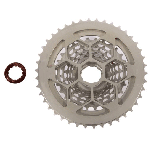 The Prestacycle Uniblock PRO Gravel Cassette (11 Speed) (Shimano) is shown with a brown lockring on a white background. Features a durable chromoly steel build, multiple gears, and a honeycomb-patterned center for superior performance.